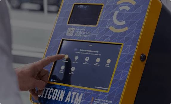 A customer selecting a cryptocurrency on a CoinFlip bitcoin ATM touchscreen in New Zealand